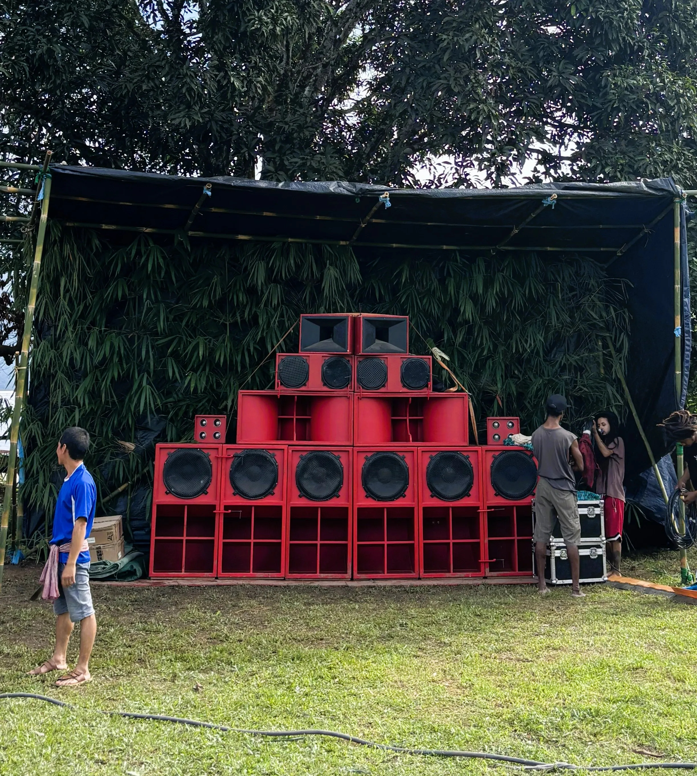 The woven bamboo BFR sound-system booth on the festival grounds by day